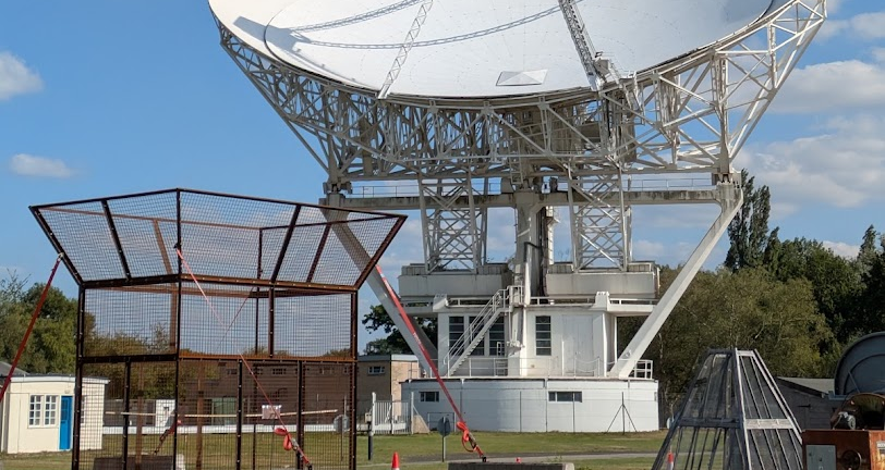 The RHINO mesh horn frame under construction at Jodrell Bank, a large dish behind